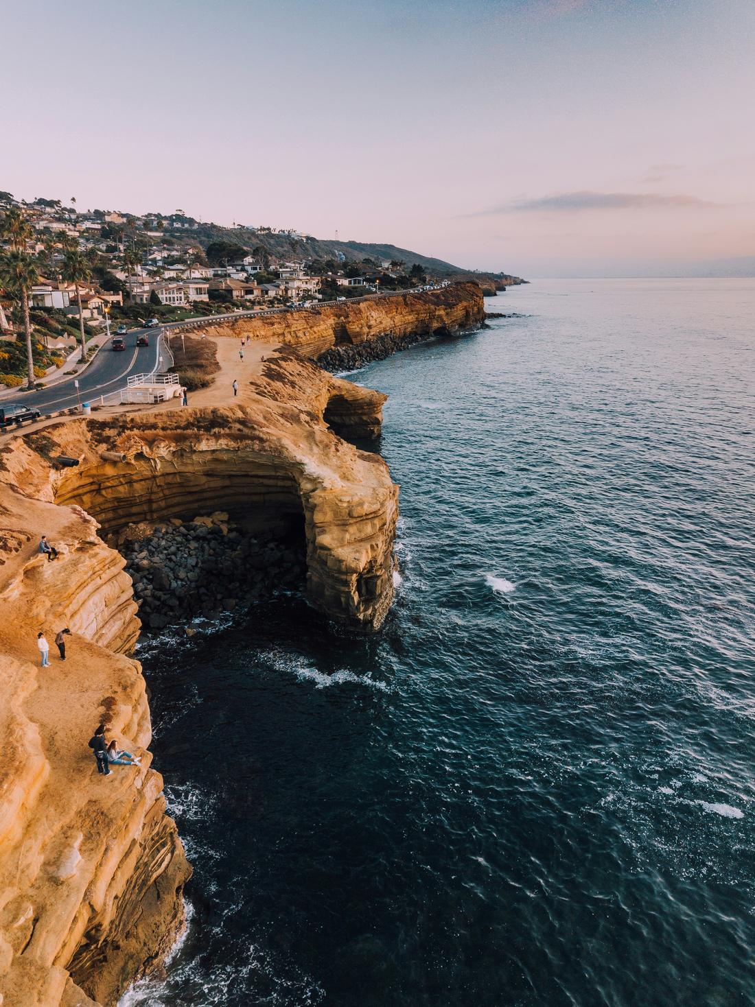 Sandstone cliffs and coves along the San Diego coast at dusk.